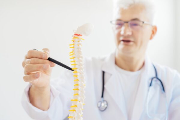 Specialist performing interventional spine treatment for back and spine pain relief